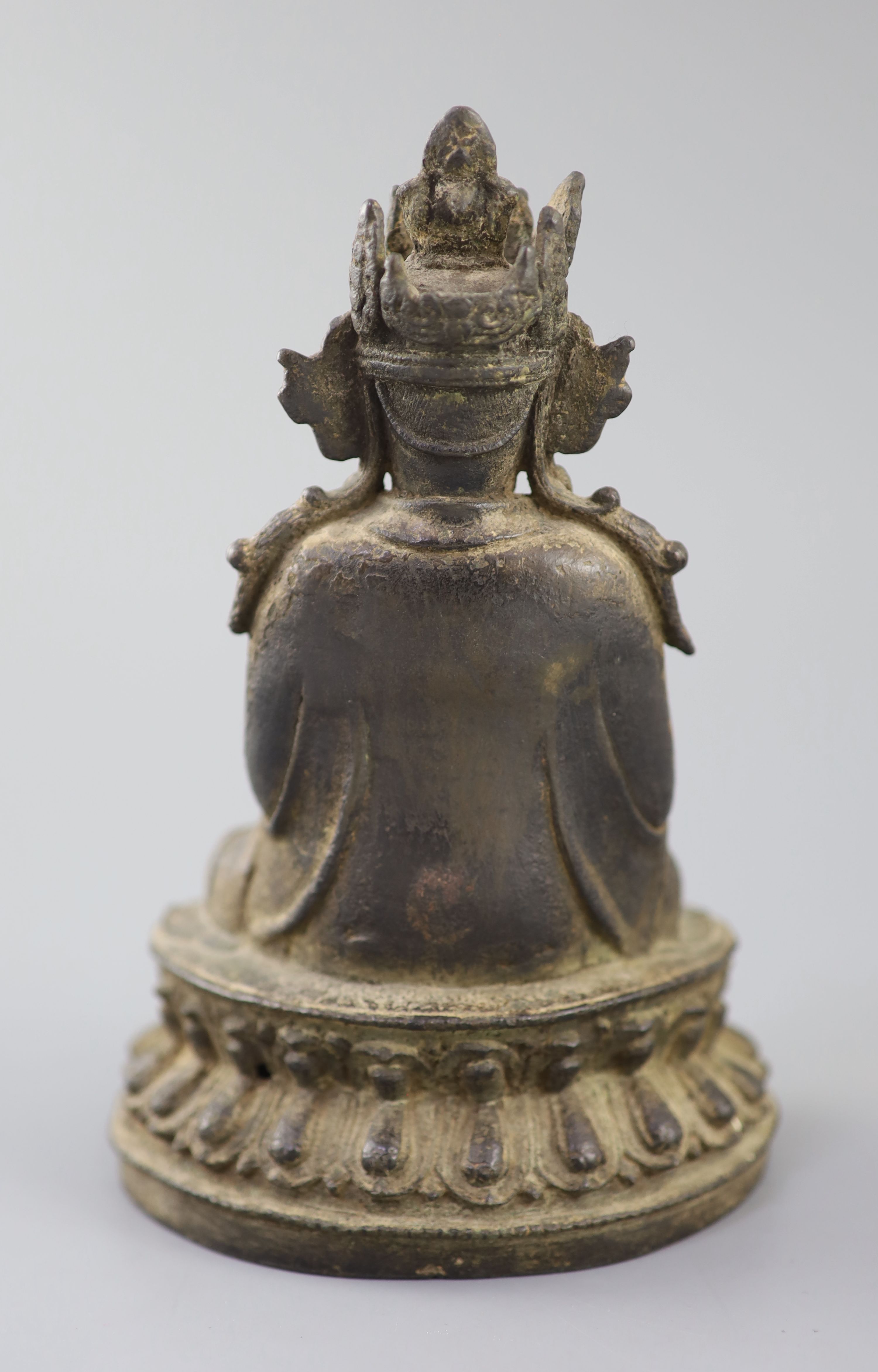 A Chinese bronze figure Amitayus, 17th century, 20cm high, losses to crown